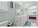 Bathroom with double vanity, a toilet, and view of bedroom at 747 Coquina Bay Dr., Conway, SC 29526