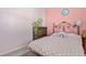 Bright bedroom with pink walls and rainbow bedding at 747 Coquina Bay Dr., Conway, SC 29526