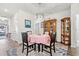 Cozy dining area with a round table and display cabinets at 747 Coquina Bay Dr., Conway, SC 29526