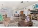Spacious living room features hardwood floors, comfortable seating, and a large TV at 747 Coquina Bay Dr., Conway, SC 29526