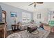 Bright living room with hardwood floors, neutral walls, and comfy seating at 747 Coquina Bay Dr., Conway, SC 29526