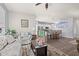 Open living room with kitchen view, hardwood floors, and ample natural light at 747 Coquina Bay Dr., Conway, SC 29526