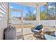 Relaxing screened porch with wicker chairs and backyard view at 747 Coquina Bay Dr., Conway, SC 29526