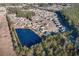 This aerial view showcases a community with well-maintained homes nestled around a serene lake at 817 Payne Ct., Conway, SC 29526