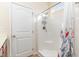 Well-lit bathroom with a shower featuring a built-in seat and chrome fixtures at 817 Payne Ct., Conway, SC 29526