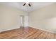 Spacious bedroom with trey ceiling, ceiling fan, and wood-look flooring at 817 Payne Ct., Conway, SC 29526