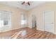 Bedroom with hardwood floors, ceiling fan, and ensuite bath at 817 Payne Ct., Conway, SC 29526