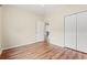 Bedroom with wood-look flooring, ceiling fan and closet for ample storage at 817 Payne Ct., Conway, SC 29526