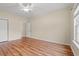 Bedroom with wood-look floors, ceiling fan and closet for ample storage at 817 Payne Ct., Conway, SC 29526
