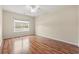 Bright bedroom with a large window and wood-look flooring at 817 Payne Ct., Conway, SC 29526