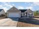 Charming single-story home with a two-car garage, well-manicured lawn, and classic architectural details at 817 Payne Ct., Conway, SC 29526