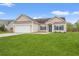 Charming single-story home with a manicured lawn, two-car garage, and inviting blue-shuttered windows at 817 Payne Ct., Conway, SC 29526