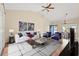 Bright, modern living room with high ceilings, stylish furniture, an eye-catching rug, and a view into the dining area at 817 Payne Ct., Conway, SC 29526