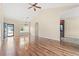 Spacious living room featuring hardwood floors, a vaulted ceiling, and an open view of the front entrance and kitchen at 817 Payne Ct., Conway, SC 29526
