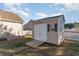 Tan storage shed with white doors and ramp at 817 Payne Ct., Conway, SC 29526