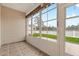 Sunroom with tile flooring and large windows offering scenic outdoor views at 817 Payne Ct., Conway, SC 29526