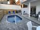 Outdoor patio with a pool, lounge chairs, grill, and dining area, creating the perfect entertainment space at 931 Edge Dr., North Myrtle Beach, SC 29582