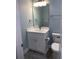 Well-lit bathroom with white vanity, marble countertop, and modern fixtures at 931 Edge Dr., North Myrtle Beach, SC 29582