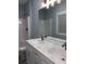 Bathroom with double sink vanity with white countertops and shower at 931 Edge Dr., North Myrtle Beach, SC 29582