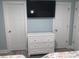 Bright bedroom with white dresser, flat screen TV, and neutral walls at 931 Edge Dr., North Myrtle Beach, SC 29582