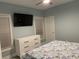 Bedroom featuring neutral walls, dresser with TV, and natural lighting at 931 Edge Dr., North Myrtle Beach, SC 29582