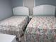 Bedroom featuring two twin beds with patterned bedding and white headboards at 931 Edge Dr., North Myrtle Beach, SC 29582