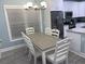 Open dining area with table, chairs, chandelier, and natural light at 931 Edge Dr., North Myrtle Beach, SC 29582