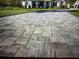 Grey paver driveway leading to a large home at 931 Edge Dr., North Myrtle Beach, SC 29582