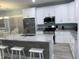 Spacious kitchen with white cabinets, stainless steel appliances, and granite countertops at 931 Edge Dr., North Myrtle Beach, SC 29582