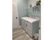 Laundry room with modern washer and dryer units and shelving at 931 Edge Dr., North Myrtle Beach, SC 29582