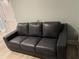 Comfortable gray leather couch in living room area of property at 931 Edge Dr., North Myrtle Beach, SC 29582