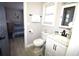 Well-lit bathroom with white vanity, modern fixtures, and adjacent bedroom view at 9620 Windchime Dr., Myrtle Beach, SC 29572