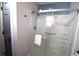 Accessible bathroom with a sliding glass shower door and safety grab bars at 9620 Windchime Dr., Myrtle Beach, SC 29572