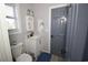 Bright bathroom with white vanity, wood-look flooring, and modern fixtures at 9620 Windchime Dr., Myrtle Beach, SC 29572