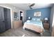 Bright bedroom with beach themed bedding, ceiling fan, and closet at 9620 Windchime Dr., Myrtle Beach, SC 29572