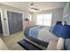 Serene bedroom with blue accents, a comfortable bed, and ample closet space at 9620 Windchime Dr., Myrtle Beach, SC 29572