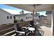 Inviting covered deck with comfortable Adirondack seating and charming neighborhood views at 9620 Windchime Dr., Myrtle Beach, SC 29572