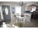 Cozy dining area with modern table, chairs, and easy access to the kitchen and front door at 9620 Windchime Dr., Myrtle Beach, SC 29572