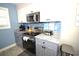 Efficient kitchen showcasing granite countertops, stainless appliances, and modern lighting at 9620 Windchime Dr., Myrtle Beach, SC 29572