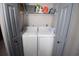 Functional laundry room with side by side washer and dryer and convenient shelving at 9620 Windchime Dr., Myrtle Beach, SC 29572