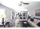 Cozy living area with open layout, stylish furniture, wood-look flooring, and adjacent dining area at 9620 Windchime Dr., Myrtle Beach, SC 29572