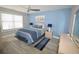 Serene main bedroom featuring a large window, modern ceiling fan and coordinated décor at 9620 Windchime Dr., Myrtle Beach, SC 29572