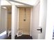 A close up of the outdoor shower showing the shower head with a wood panel background at 9620 Windchime Dr., Myrtle Beach, SC 29572