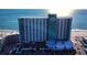 Aerial view of beachfront high rise building with ocean and city views at 1210 N Waccamaw Dr. # 702, Murrells Inlet, SC 29576