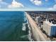 Aerial view of oceanfront high rise building and beach at 1210 N Waccamaw Dr. # 702, Murrells Inlet, SC 29576