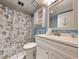 Clean bathroom with white vanity, shower, and nautical-themed decor at 1210 N Waccamaw Dr. # 702, Murrells Inlet, SC 29576