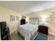 Comfortable bedroom with nautical-themed bedding and TV at 1210 N Waccamaw Dr. # 702, Murrells Inlet, SC 29576