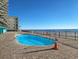 Community pool area with ocean view at 1210 N Waccamaw Dr. # 702, Murrells Inlet, SC 29576