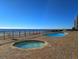 Oceanfront pool and hot tub area at 1210 N Waccamaw Dr. # 702, Murrells Inlet, SC 29576