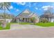 Brick and shingle front elevation of charming house with manicured lawn and driveway at 204 Atoll Dr., Myrtle Beach, SC 29588